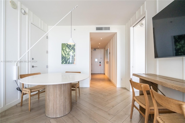 dining area with light parquet flooring