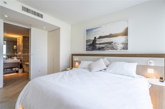 bedroom featuring hardwood / wood-style floors