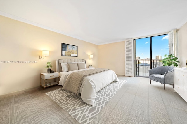 bedroom with access to outside, crown molding, expansive windows, and light colored carpet