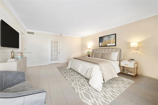 bedroom with light carpet and ornamental molding