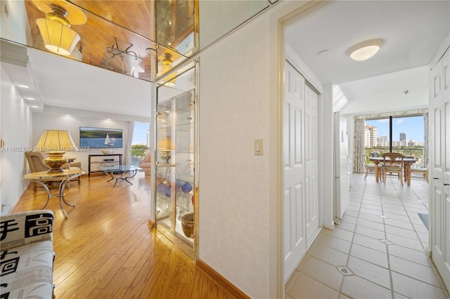 corridor with light hardwood / wood-style floors