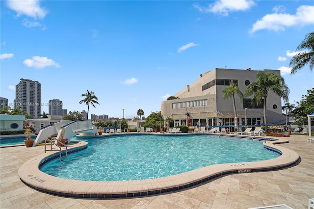 view of swimming pool with a patio