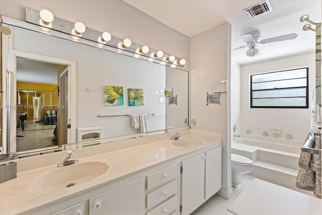 bathroom with toilet, ceiling fan, tile patterned floors, and vanity