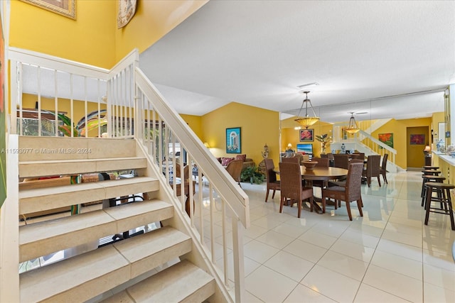 staircase featuring tile patterned floors