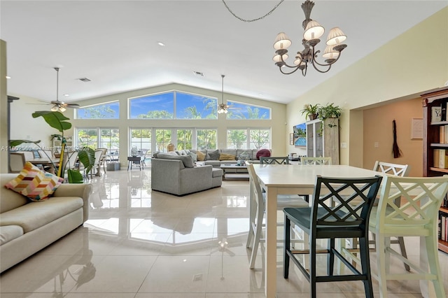 interior space with ceiling fan with notable chandelier, light tile patterned floors, and lofted ceiling