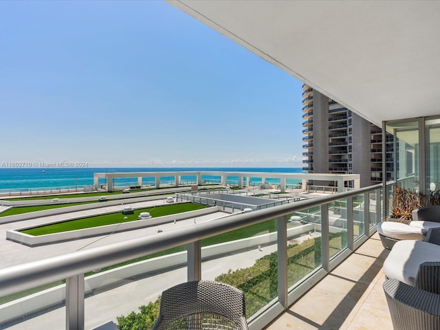 balcony featuring a water view