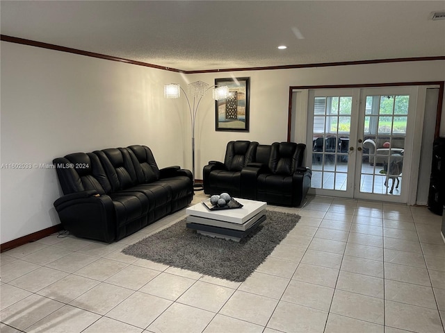 tiled living room with french doors, a textured ceiling, and ornamental molding