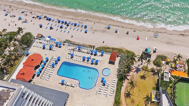 birds eye view of property featuring a view of the beach and a water view