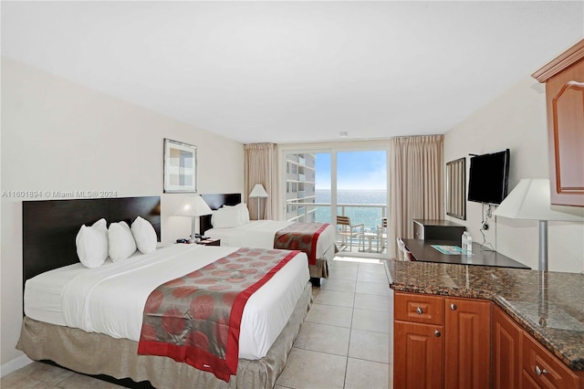 bedroom featuring access to outside and light tile patterned floors