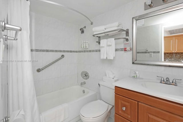 full bathroom featuring shower / bath combination with curtain, tile walls, tasteful backsplash, vanity, and toilet