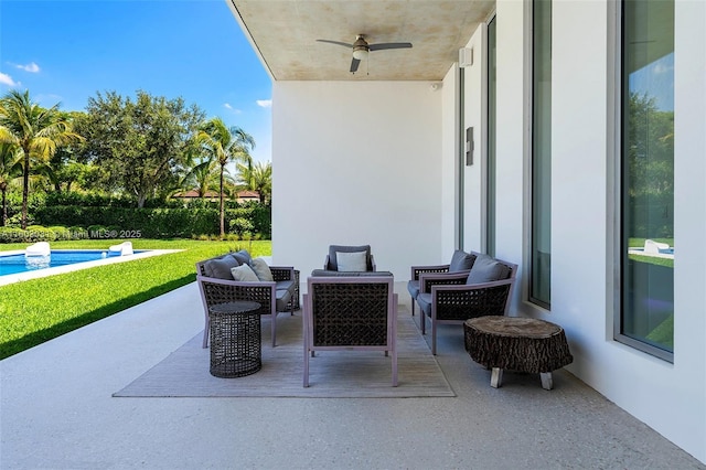 view of patio / terrace with ceiling fan and an outdoor hangout area