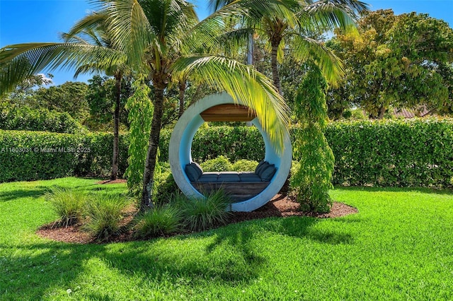 community sign featuring a lawn