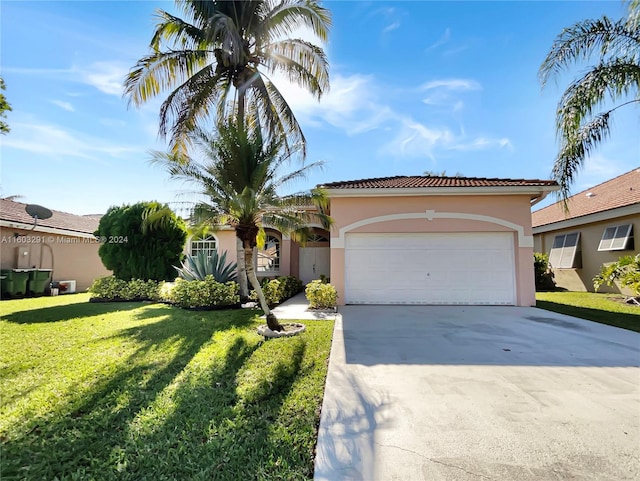 view of front of house with a garage and a front yard