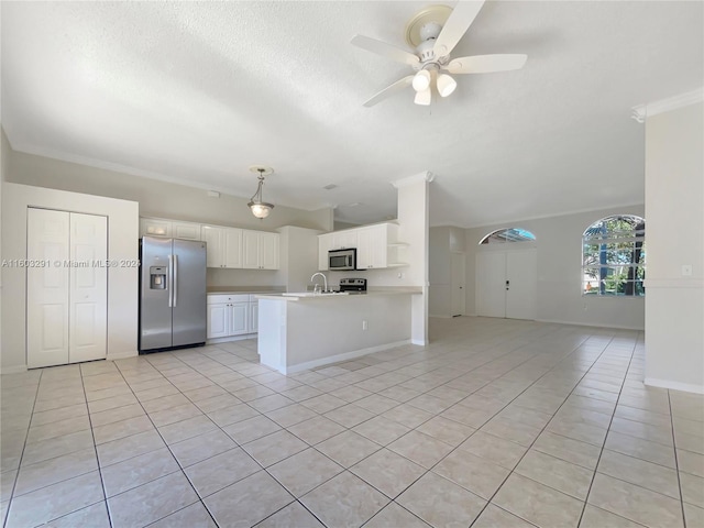 kitchen featuring appliances with stainless steel finishes, white cabinetry, ceiling fan, and light tile floors