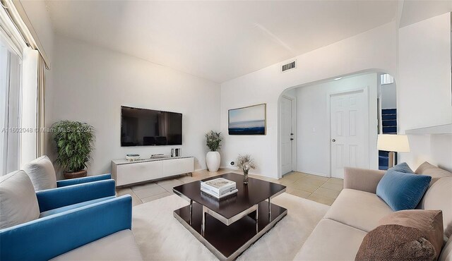 living room with light tile patterned flooring