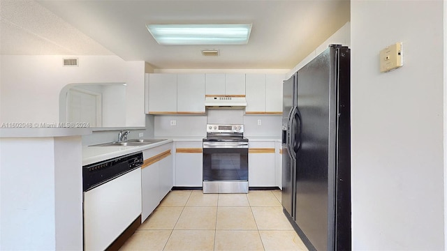 kitchen with sink, premium range hood, stainless steel range with electric stovetop, dishwasher, and black fridge