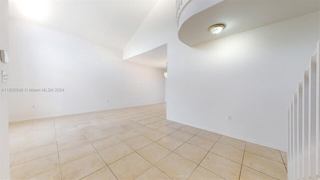 unfurnished room featuring light tile patterned floors