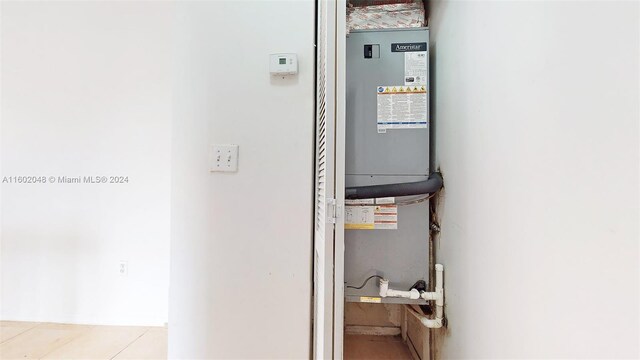 utility room with water heater