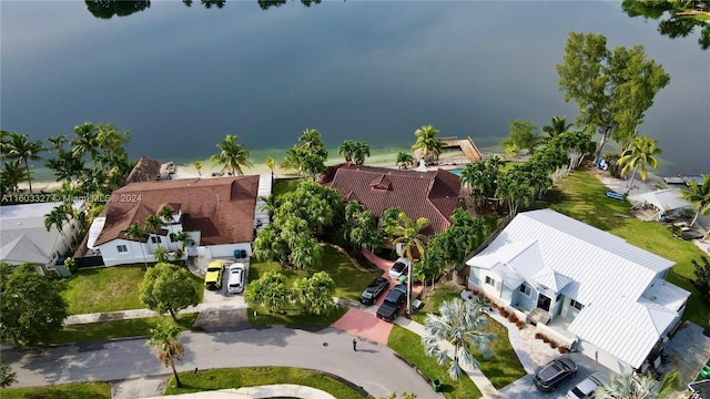 birds eye view of property featuring a water view