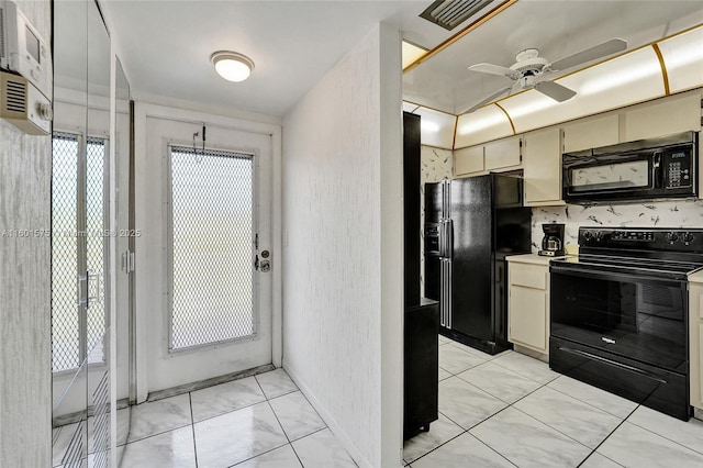 kitchen featuring ceiling fan and black appliances