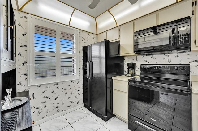 kitchen with light tile patterned floors, ceiling fan, and black appliances