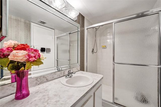 bathroom with vanity and walk in shower