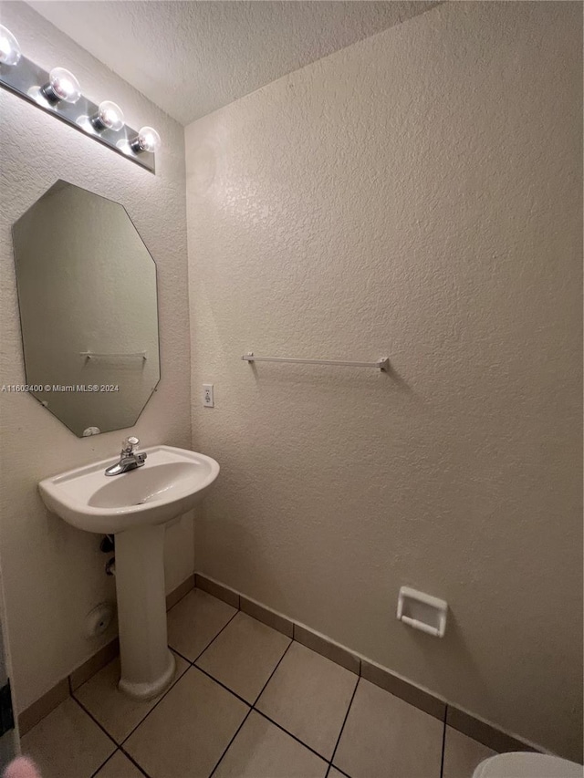 bathroom featuring tile floors