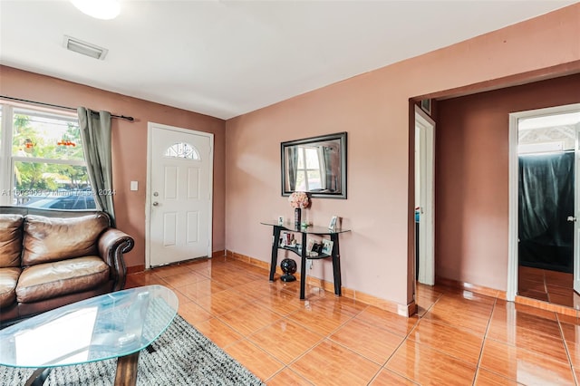 living room featuring light tile flooring