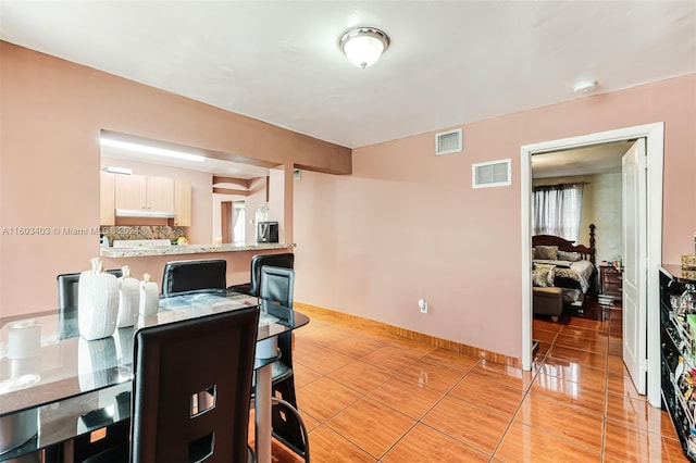 view of tiled dining space