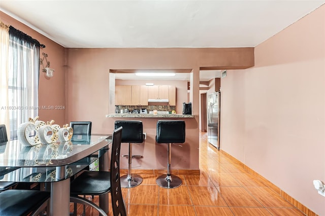 view of tiled dining space