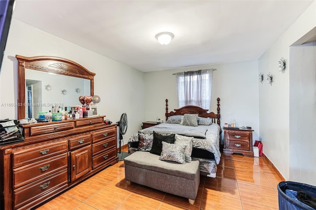 bedroom with light tile flooring