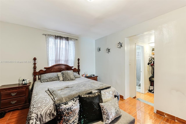 bedroom featuring light tile flooring