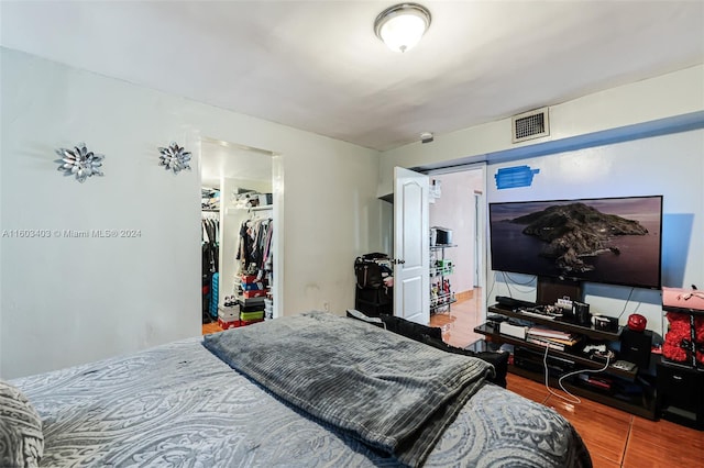 bedroom featuring a closet and hardwood / wood-style floors