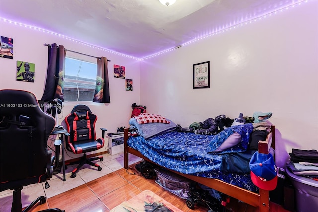 bedroom with light tile floors