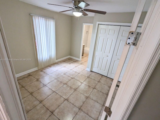 tiled foyer entrance featuring ceiling fan