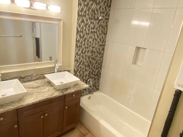 bathroom with tile floors, shower / tub combo with curtain, and vanity