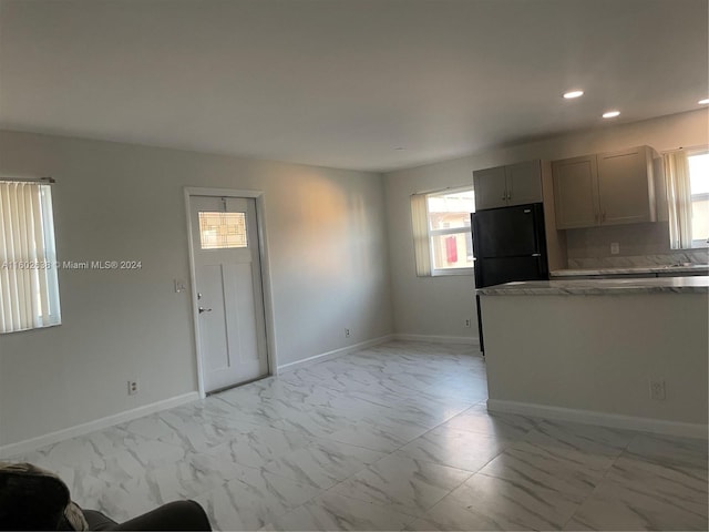 kitchen with black fridge