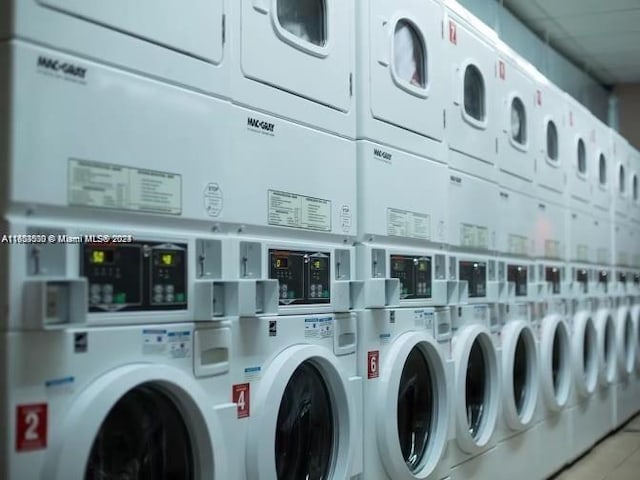 washroom with stacked washer and dryer