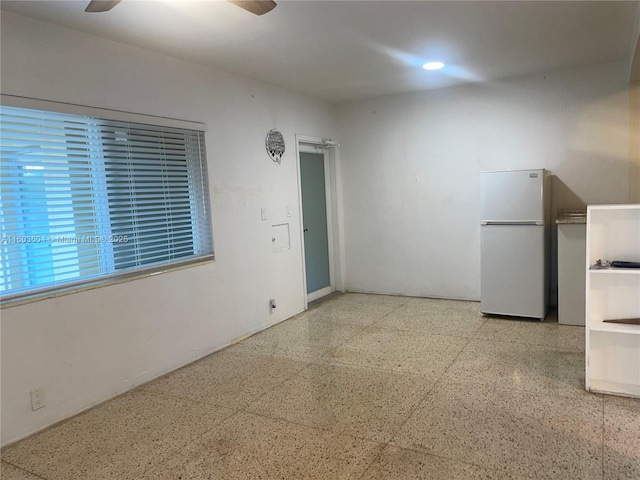 unfurnished room with ceiling fan