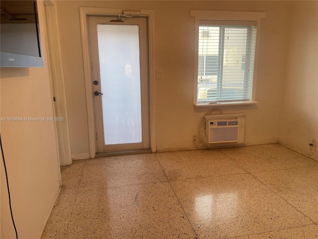 interior space with a wall mounted air conditioner