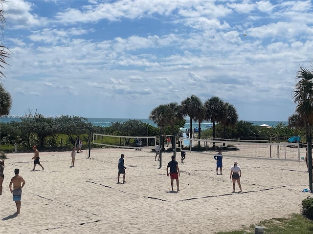 view of community featuring a water view and volleyball court