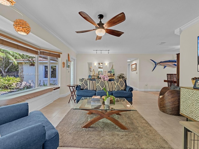 tiled living room with ceiling fan and crown molding