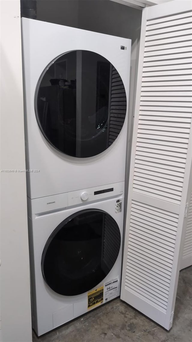 laundry room featuring stacked washer and clothes dryer