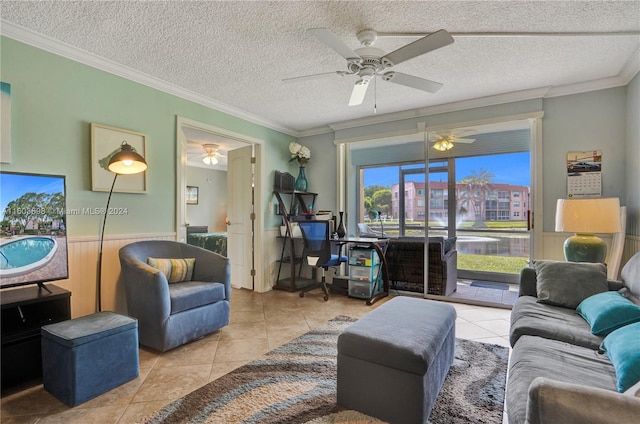 living room with tile floors, a textured ceiling, crown molding, and ceiling fan