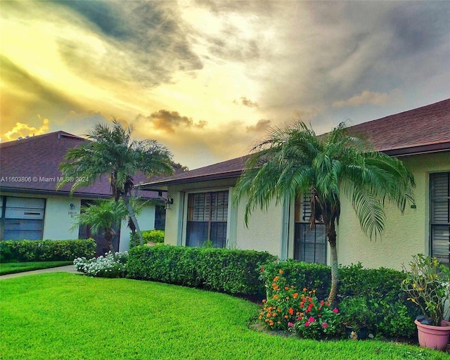 view of front of house with a yard