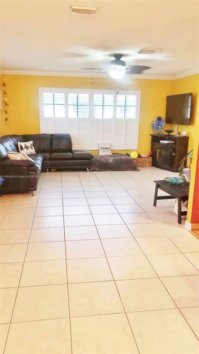 tiled living room with crown molding