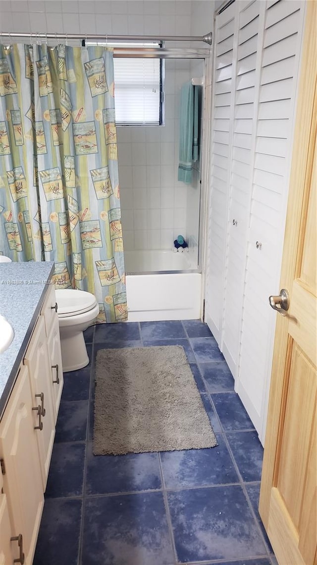 full bathroom featuring toilet, shower / tub combo, vanity, and tile patterned floors