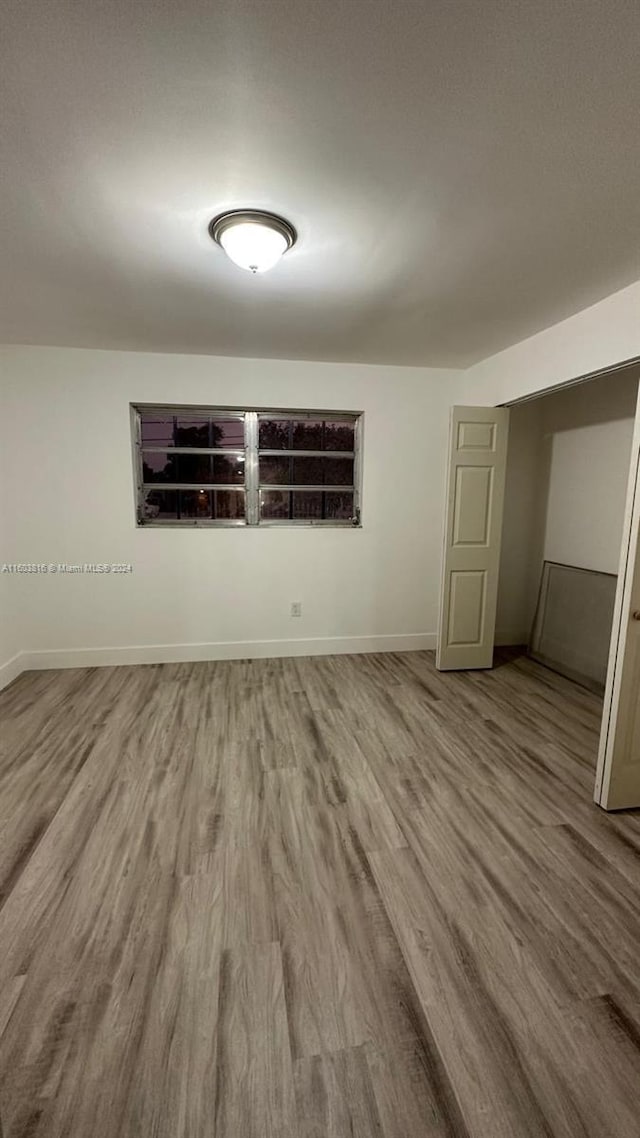 empty room featuring hardwood / wood-style floors