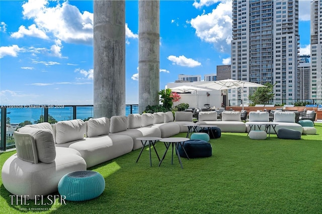 exterior space featuring an outdoor hangout area and a water view