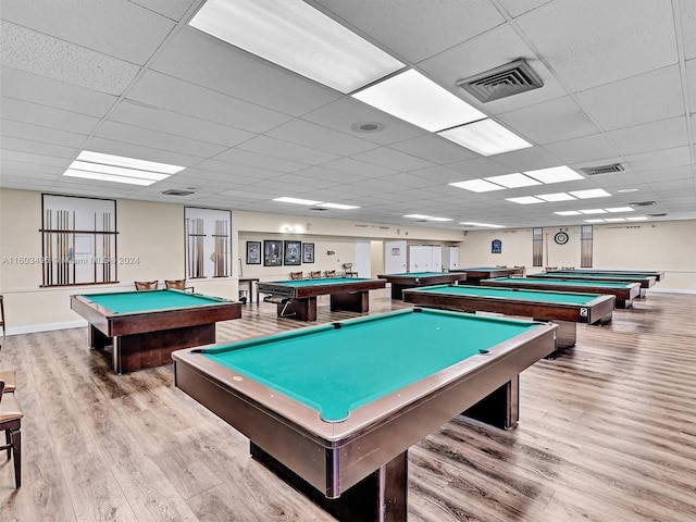 playroom with a paneled ceiling, light hardwood / wood-style flooring, and pool table